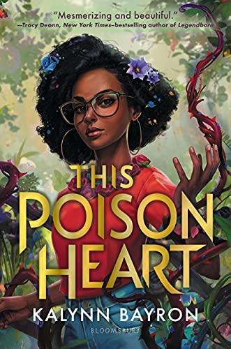 Book Cover of This Poison Heart. A young black women stands in the foreground with spine covered vines wrapping around her hands. She has blue and purple flowers in her hair and is in the forest.  